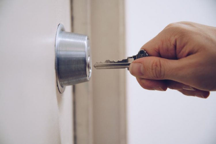 key-to-padlock-in-hand key-to-padlock-in-hand